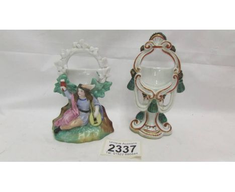 Two ceramic pocket watch stands.