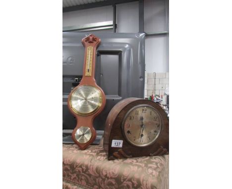 A mantel clock and a banjo barometer. (Collect only)