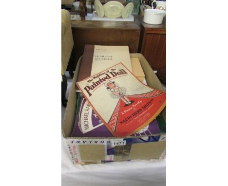 A box of vintage sheet music books