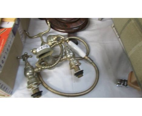 A used brass effect vintage style bath mixer taps with shower attachment