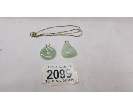Two Jade pendants and a chain.