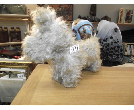A vintage straw filled Scotty dog