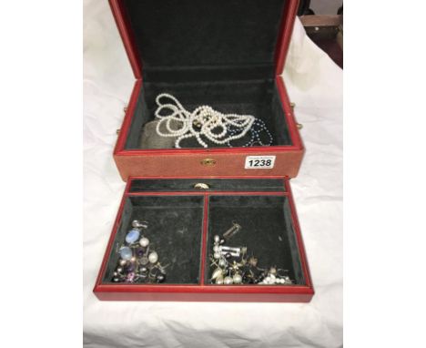 A jewellery box containing pearl necklaces, 2 silver brooches &amp; approximately 17 pairs of earrings including some silver 