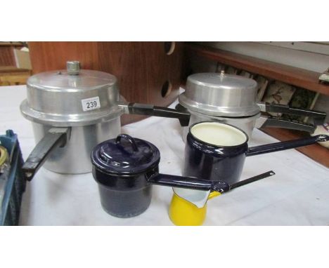 Two pressure cookers and three enamel pans. (Collect only)
