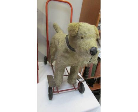A vintage push-a-long dog on wheels