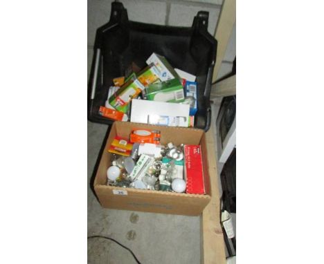 Two boxes of assorted light bulbs.