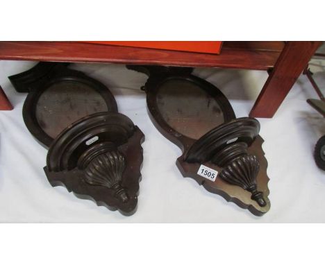 A pair of mirror backed shelf sconces