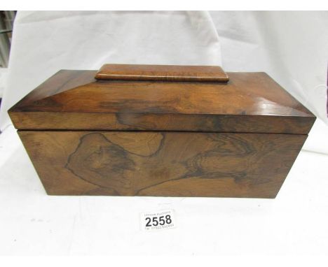 A Victorian mahogany tea caddy.