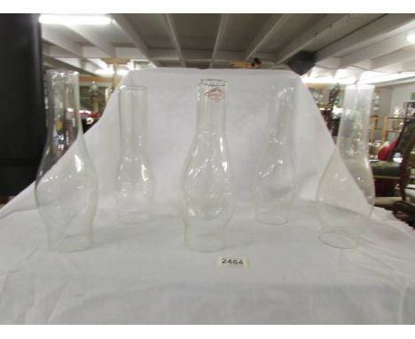 Six glass oil lamp chimneys, all in good condition. (2 are 25cm tall &amp; 4 are 26cm tall)