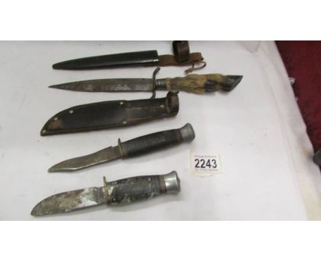 Three old hunting knives.