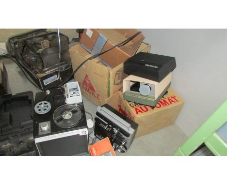 A Canon 8 TV style movie projector, an Automat slide projector and a Tower superb projector. (Collect only)