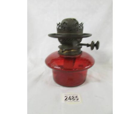 A genuine ruby glass drop in oil lamp font with original Hinks burner, in good condition.