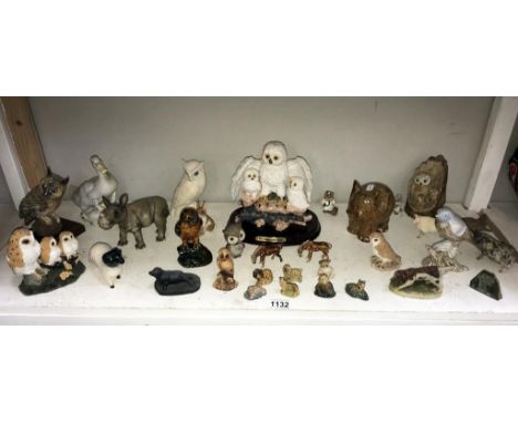 A shelf of animal ornaments including Wade &amp; resin etc.