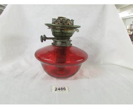 A genuine ruby glass drop in oil lamp font with original Veritas burner, in good condition.