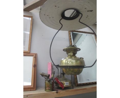 A hanging oil lamp missing glass, a Pri-Mus burner and vintage blow lamp