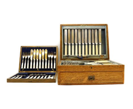 An Edwardian oak canteen of silver plated cutlery,by Elkington &amp; Co, comprising twelve dessert forks, twelve dessert spoo