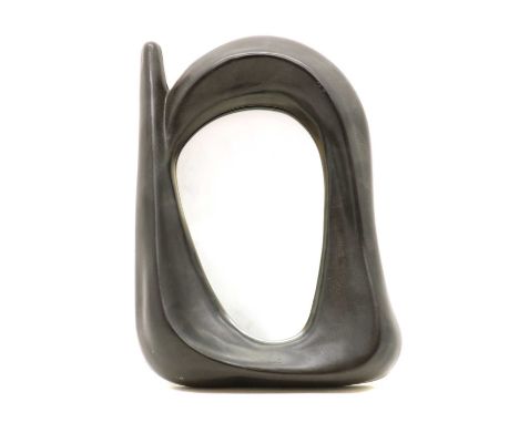 A ceramic wall mirror,of recent manufacture,26cm wide 36cm high