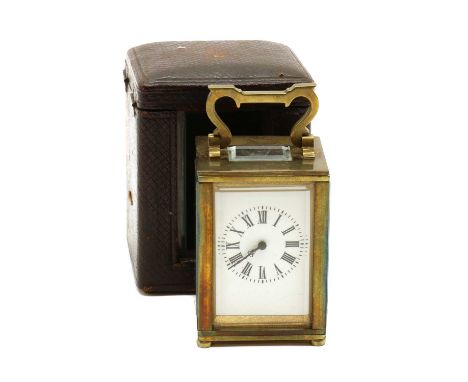 A miniature brass carriage timepiece,early 20th century, French, with a bevelled glass case, enclosing a single train movemen