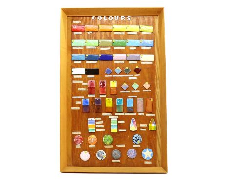 An enamel colour board,1960s, comprising fifty individually enamelled copper tabs arranged by colour, each with a descriptive