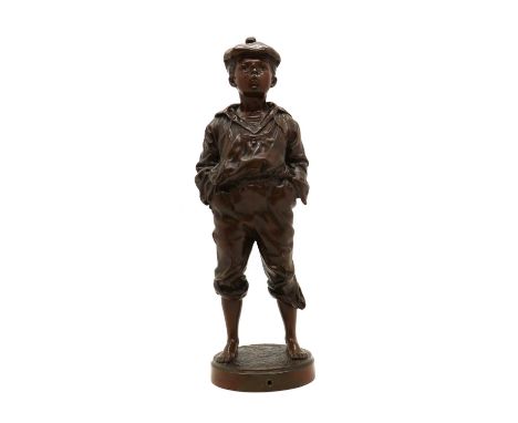 Vaclav Szczeblewski,a bronze figure 'Le Siffleur', a young boy whistling with his hands in his pockets on a circular naturali