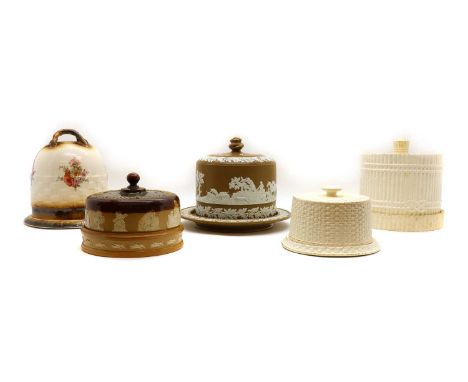 A collection of Stilton dishes,comprising two cream glazed earthenware examples, the larger 25cm high, a wedgewood jasperware