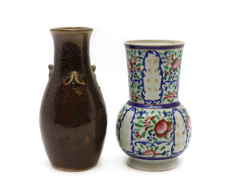 Two Chinese porcelain vases,Qing Dynasty, a polychrome enamelled floral vase, anda mottled flambé glazed vase with applied lu