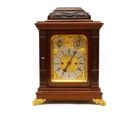 A George II-style mahogany mantel clock by John Walker of London, c.1900, the case carved with swags and harebells, enclosing