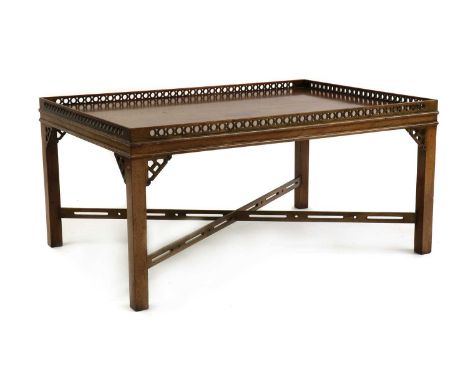 A mahogany Chippendale-style coffee table,20th century, of rectangular form, with a latticed edge, raised on square supports 