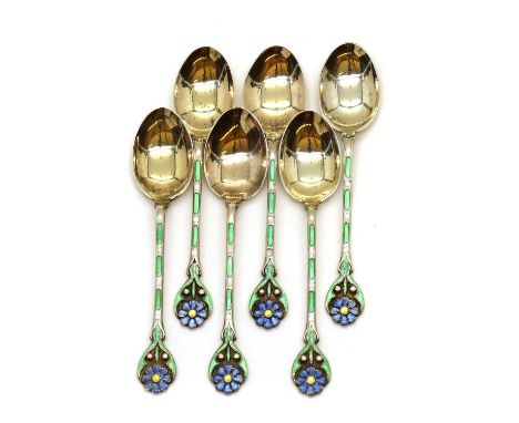 A collection of cased silver flatware,comprising a set of six enamel spoons, decorated with blue flowers to green handles, an