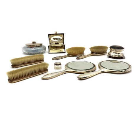 A group of silver, silver pique and tortoiseshell dressing table items,comprising a hand mirror and brush, by Elkington &amp;