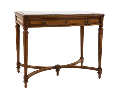 A Louis XVI-style walnut bijouterie table by Edmond Poteau of Paris, c.1900, the rectangular top inset with bevelled glass, w