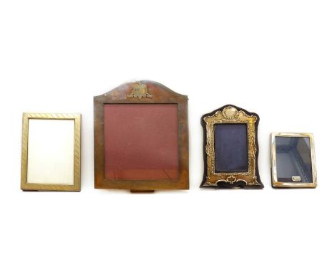 A collection of silver photograph frames,comprising a large example, by Heeramaneck, 24cm wide, 29cm high, and a smaller exam