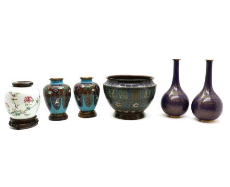 A Chinese famille rose ginger jar,c.1900, enamelled with a bird on a branch, underglaze double ring mark, with a wood stand a