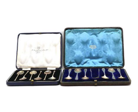 Two cased sets of silver flatware,comprising a Victorian set of six teaspoons and sugar tongs, London 1890, and another set o