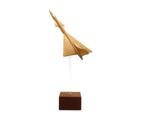 A Swedish teak model,1960s, modelled as a Saab Gripen aeroplane, raised on a lucite support, terminating onto a teak base, 33
