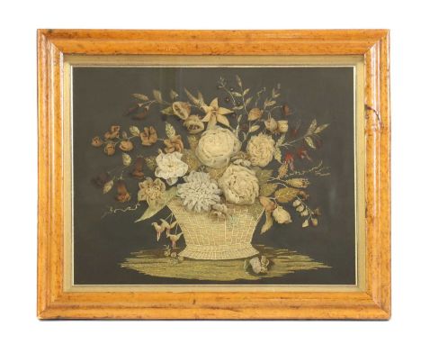A Victorian textile diorama,depicting a basket of flowers to a black ground, in a maple box frame,42 x 52cmCondition ReportGe