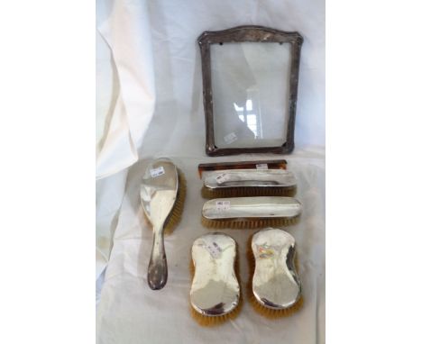 Various silver mounted dressing table brushes and comb - sold with a silver fronted photograph frame - various condition
