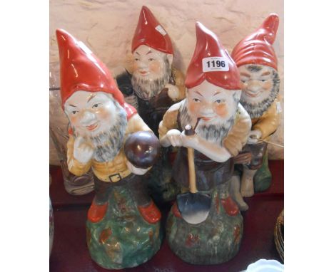 Four large ceramic gnomes - various condition