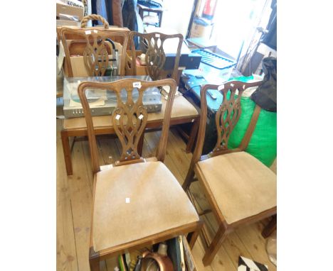 A set of four old mahogany framed Chippendale style ribbon back dining chairs, with upholstered drop-in seats, set on chamfer