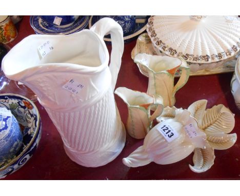 A Royal Worcester porcelain floral form wall pocket - sold with two Royal Worcester leaf form jugs and a Kirkhams pottery sim