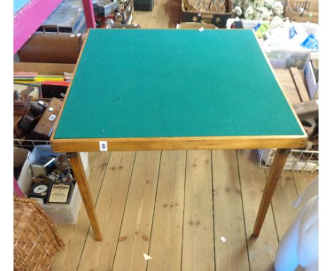 A vintage Vono stained wood folding card table with green baise top