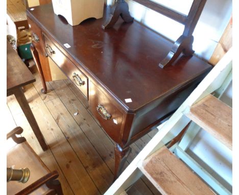 A 1.07m Edwardian walnut dressing table with three frieze drawers, set cabriole legs with pad feet - superstructure missing