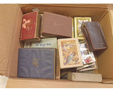 A box containing assorted playing cards and other games including Buchanans Black and White Whiskey advertising card/wallet s