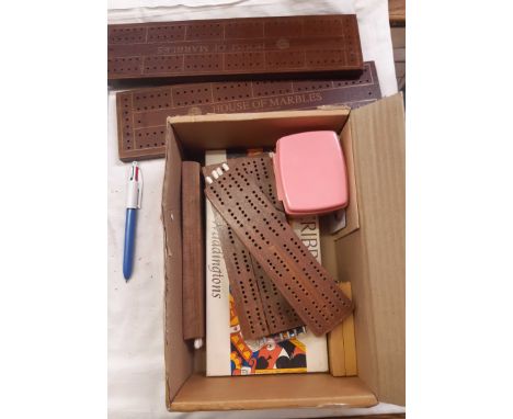 A small box containing a quantity of wooden and other cribbage boards