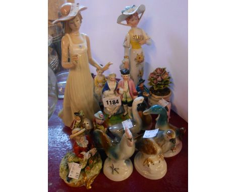 A quantity of assorted ceramic figurines including animals, Capodimonte, Nao, etc.