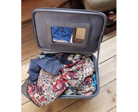 A modern travelling vanity case containing a quantity of vintage and later silk and other fashion scarves