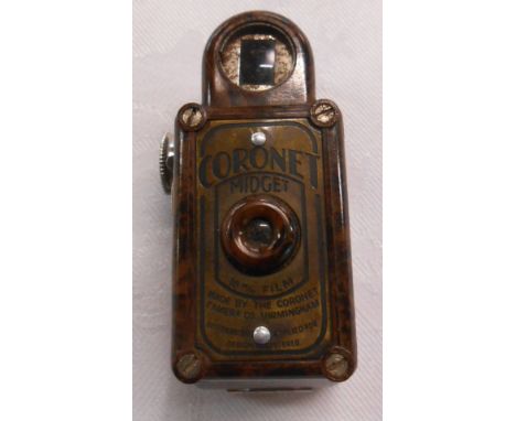 A vintage Coronet Midget miniature camera with brown Bakelite case