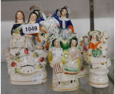 Seven Staffordshire figures including flatback clock, group, etc.
