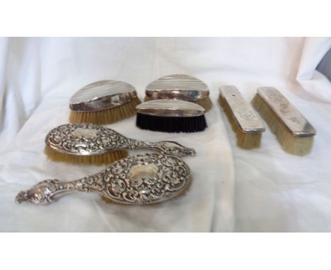 Various silver mounted dressing table brushes - various age, makers and condition