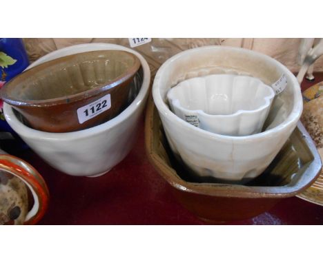 Five vintage jelly moulds including Shelley, salt glazed stoneware, and other examples